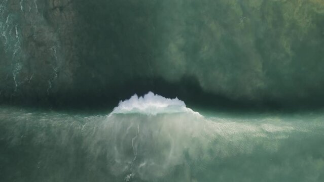 Uluwatu bali island indonesia aerial top down of huge scenic ocean waves 