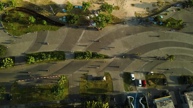 People walking and cycling on boardwalk of Kuta Mandalika, Lombok