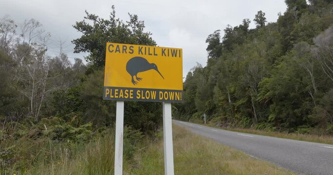 Aerial: Road sign warning for kiwi birds, South Island, New Zealand