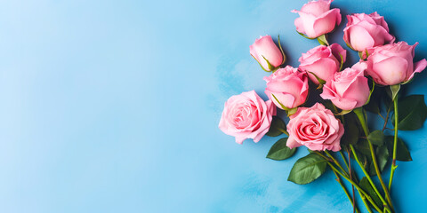 Pink roses on blue background top view with copy space for text. Generative AI	