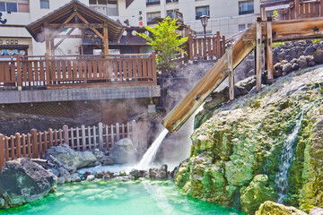 Yubatake onsen, hot spring wooden boxes with mineral water in Kusatsu onsen, Gunma prefecture, Japan.