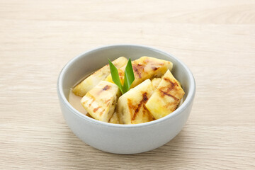 Pisang Gapit or Pisang Epe, grilled banana with palm sugar sauce. Indonesian traditional food.
