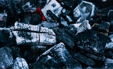 Background of burning hot coals. Burning coals in the brazier, barbecue grill