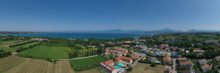 Aerial panorama of the popular Amusement Park on Lake Garda aerial view. Amusement park, attractions on Lake Garda in Italy, aerial view. Attractions in Italy.
