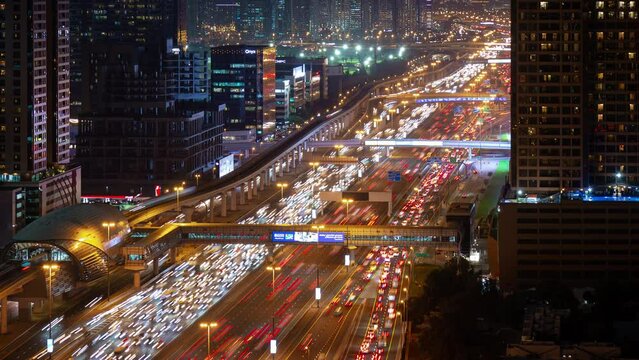 night illuminated dubai city main traffic road rush hour rooftop panorama 4k timelapse uae 