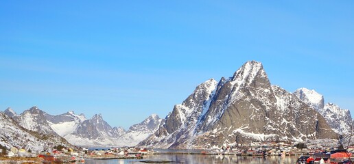 Panoramic view of snow mountain and fisherman village..