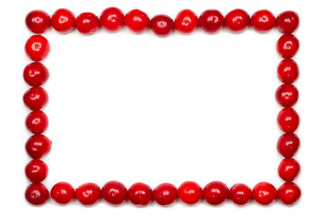 Cherry frame on a white background. The frame is made of red natural cherries.