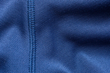Blue sports clothing fabric football shirt jersey texture with stitches - obrazy, fototapety, plakaty