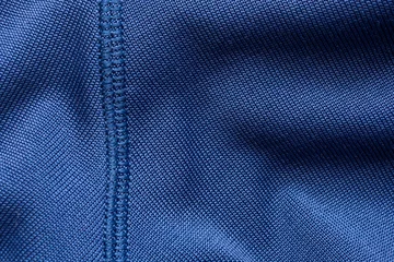Fotobehang Blue sports clothing fabric football shirt jersey texture with stitches © Piman Khrutmuang