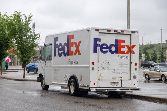 Calgary, Alberta, Canada. Jun 20, 2023. Back view of a Fedex delivery truck van