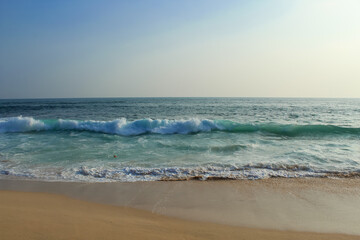 Expansive view from above of the awesome greenish turquoise waving ocean