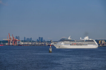Sail away departure of luxury cruiseship cruise ship liner Regatta from port of Vancouver BC,...