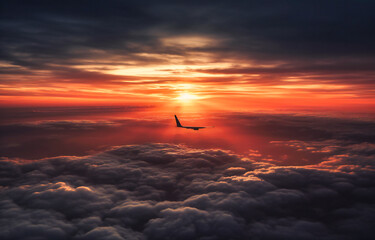 an airplane flight shows the sunrise across the clouds