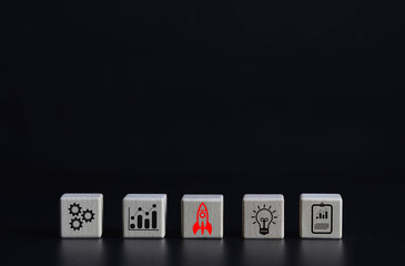 A wooden block showing a rocket icon. This is the beginning of a new generation of Entrepreneurs,...
