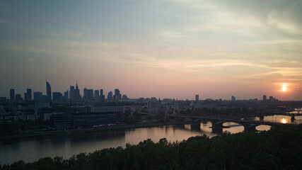 Fototapeta na wymiar City panorama, Warsaw skyline with at beautiful sunset clouds..