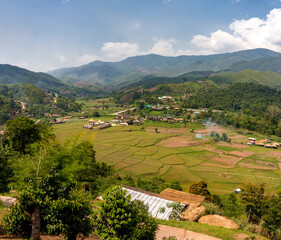 Fototapeta na wymiar A view of a valley with small rice fields in Nan Province, Northern Thailand