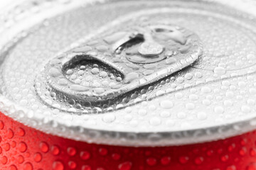 Red aluminium cans with fresh water drops texture background. Water droplets on soda can macro shot