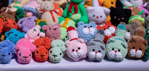 Fototapeta na wymiar dolls for children with knitting needles from scraps