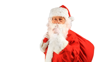 Santa Claus holding carrying sack with gifts for kids on a transparent background