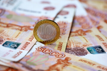 Russian rubles, coin and paper currency. Concept of economy of Russia, exchange rate