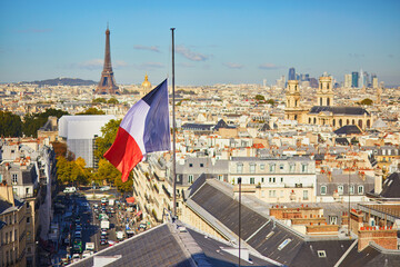 Naklejka premium Aerial view of the Eiffel tower over the French flag in Paris, France