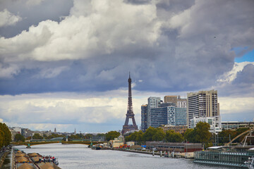 Eiffel tower over the river Seine from Garigliano bridge on a bright fall day in Paris, France