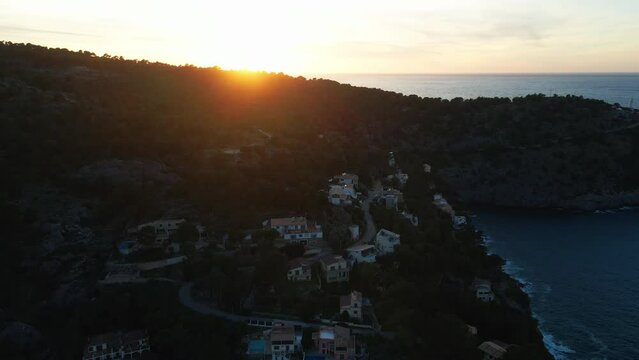 Beautiful summer sunset Port Soller, Mallorca, Spain. Panning aerial drone shot of mountains