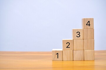 Wooden block number one two three four using as business and education concept.