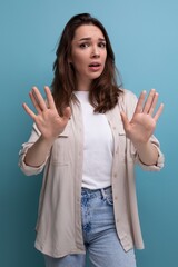 confused brunette young brunette lady dressed in shirt and jeans