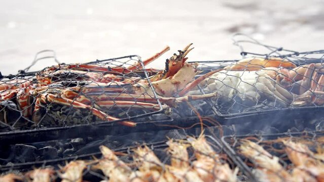 Cooking Asian Street Food from Seafood on Market. Fried Street Food on Traditional Asia Grill. Authentic Cook Shef Make Crabs and Shrimp on Fat Oil. Gastronomic Cuisine in World. Cook Man Close-up 4k
