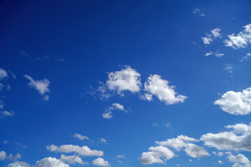 Naklejka na ściany i meble Stratus cumulus alto nimbo clouds in the blue sky is weather messengers