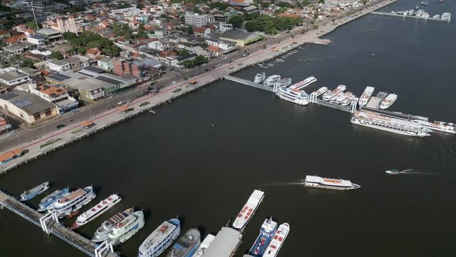 Aerial over the waterfront and city of Santar&eacute;m, State of Par&aacute;, Brazil. Drone dolly forward shot