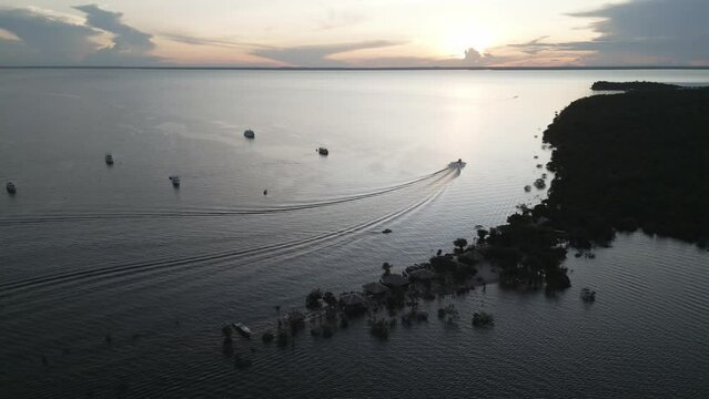Aerial at dusk over Love Island (Ilha do Amor) in State of Par&aacute;, Brazil. Drone locked shot