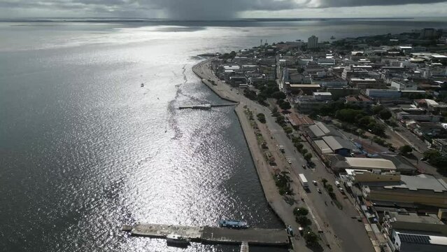 Aerial over the waterfront and city of Santar&eacute;m, State of Par&aacute;, Brazil. Drone dolly forward shot