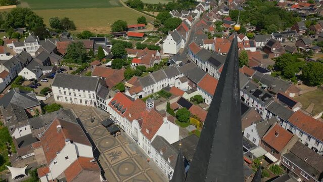 Overflight with drone over the stately Limburg Abbes Church in Thorn, Maasgouw, Wijngaard. View of the historic buildings of Dutch architecture