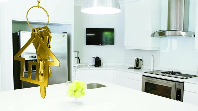 Animation of hanging golden house keys against interior of a modern kitchen