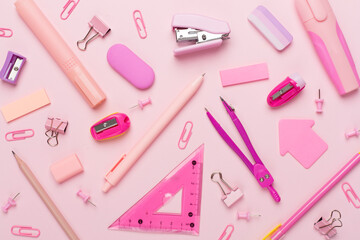 Pink school stationery on color backgroung, top view