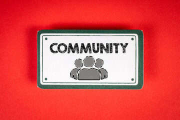 COMMUNITY Concept. Sticky note with text on a red background