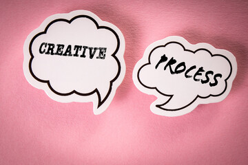 Creative Design Process Concept. Two speech bubbles with text on a pink background