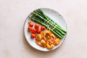 Fried shrimp with asparagus and tomatoes. Healthy eating. Diet.