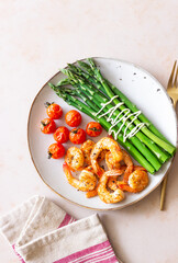 Fried shrimp with asparagus and tomatoes. Healthy eating. Diet.