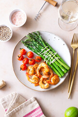 Fried shrimp with asparagus and tomatoes. Healthy eating. Diet.