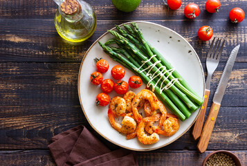 Fried shrimp with asparagus and tomatoes. Healthy eating. Diet.