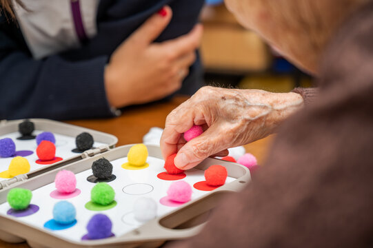 Rehabilitation center. Brain therapy cognitive psychological testing on senior patient. Alzheimer's disease and dementia prevention concept. Adaptation skills recovery. High quality photo