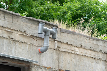 An example of do it youself ventilation system in a garage made from plastic pipes