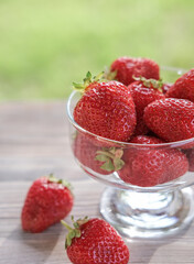 Close up of ripe strawberries in a glass bowl