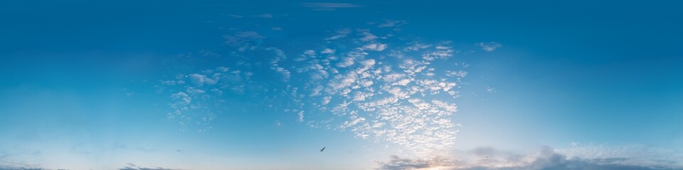 Sunset sky panorama with golden pink Cirrus clouds. Seamless hdr spherical 360 panorama. Sky dome in 3D visualization, sky replacement for aerial drone 360 panoramas. Weather and climate change