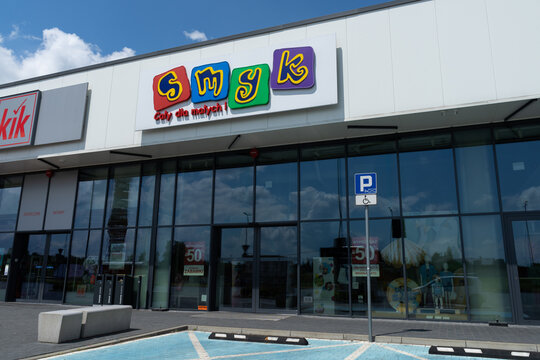 Smyk store with logo sign. Polish retail chain shop, selling products for infants and children, like toys, clothing and footwear. Signboard with brand logotype on June 18, 2023 in Chrzanow, Poland.