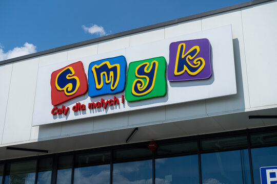 Smyk store with logo sign. Polish retail chain shop, selling products for infants and children, like toys, clothing and footwear. Signboard with brand logotype on June 18, 2023 in Chrzanow, Poland.