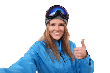 Beautiful woman in ski goggles taking selfie on white background